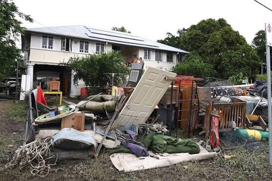 Waterlogged furniture and personal belongings evaluated after home flooding